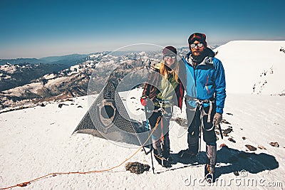 Couple Man and Woman climbing reached Elbrus mountain Stock Photo