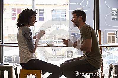 Couple Meeting For Date In Coffee Shop Stock Photo