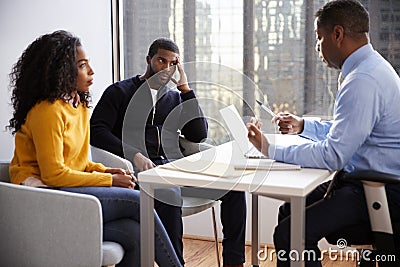 Couple Meeting With Male Financial Advisor Relationship Counsellor In Office Stock Photo