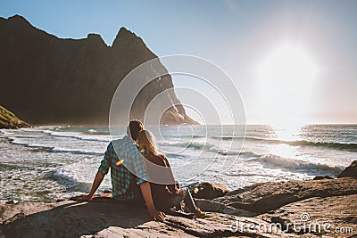 Couple man and woman in love relaxing on Kvalvika beach Stock Photo