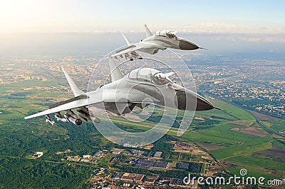 Couple military jet fighter aircraft, flying high over the city and the airport. Stock Photo