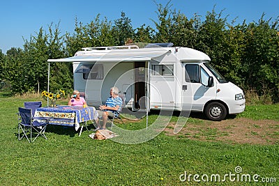 Couple with mobil home Stock Photo