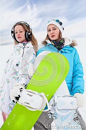 Couple modern fun snowborder girls Stock Photo