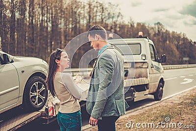 Couple near tow-truck Stock Photo