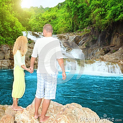 Couple near waterfall Stock Photo