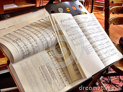 Music books on a music stand. Editorial Stock Photo