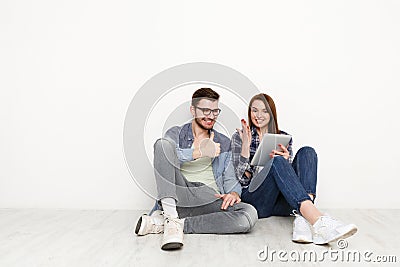 Couple ordering purchase with digital tablet Stock Photo