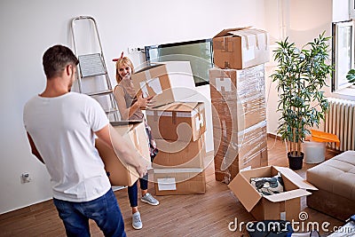 Couple packing moving boxes, ready for move out Stock Photo