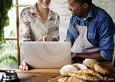Couple partnership the bakehouse with e-business online Stock Photo