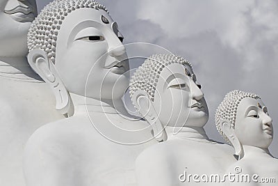 Couple peaceful white buddha statues sitting well alignment and decorating wonderful attractive mirror Stock Photo