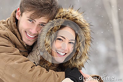 Couple with perfect teeth in winter Stock Photo