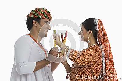 Couple performing Dandiya Raas on Navratri Stock Photo