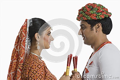 Couple performing Dandiya Raas at Navratri Stock Photo