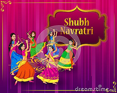 Couple performing Garba dance in Dandiya Raas for Dussehra or Navratri Stock Photo