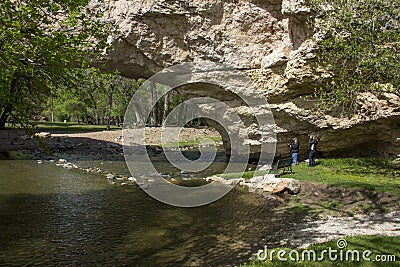 Couple Photographing Natural Arch Editorial Stock Photo