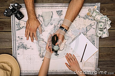 Couple planning travel and looking at compass Stock Photo