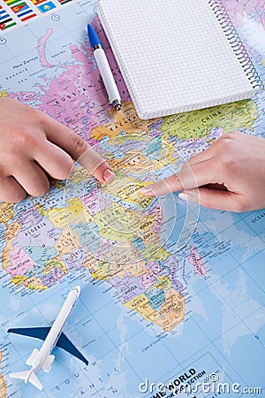 Couple planning trip to Saudi Arabia, point on map Stock Photo
