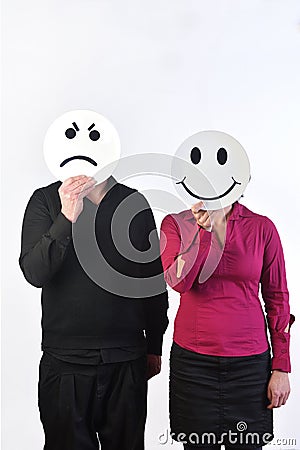 A couple with a plate in the face one happy and the other angry Stock Photo