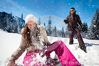 Couple playing in snow Stock Photo