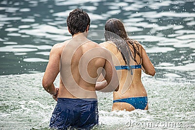 Couple playing in the water at summer Editorial Stock Photo