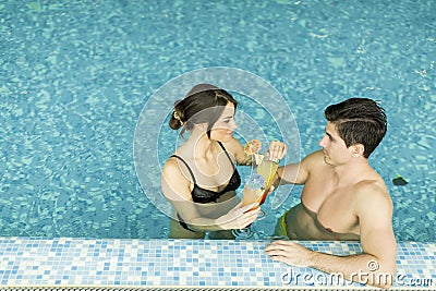 Couple by the pool Stock Photo