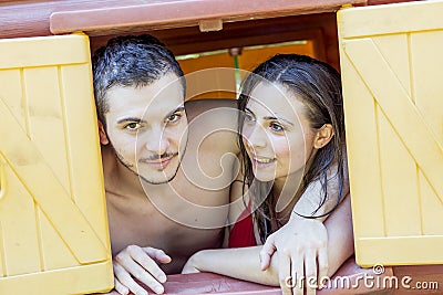 Couple portrait of lovers in swimwear looking out Stock Photo