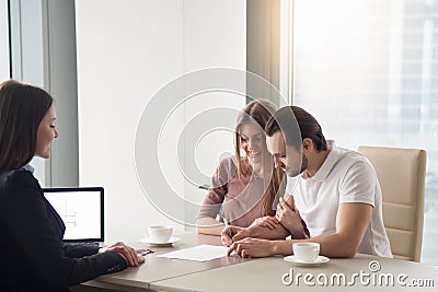 Couple purchasing, renting apartment, signing agreement contract Stock Photo