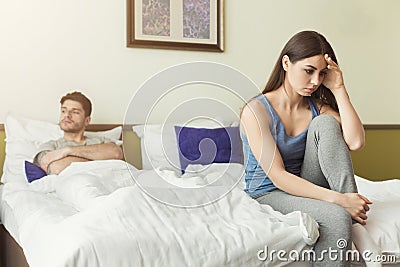 Couple after quarrel sitting in bed Stock Photo