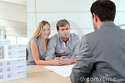 Couple in real-estate agency Stock Photo