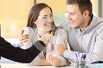 Couple receiving the new home keys Stock Photo