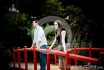 Couple on a Red Bridge Stock Photo