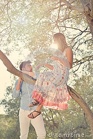 Couple relax under the tree. Fine art style. Olive garden. Stock Photo