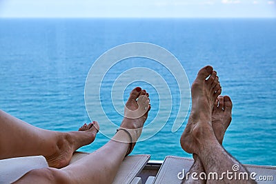 Couple relaxing on a deck chair Stock Photo