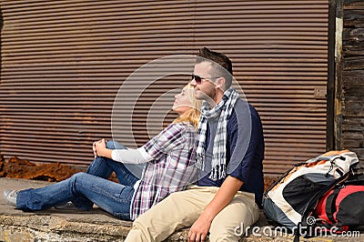 Couple resting backpack travel tired sitting trip Stock Photo