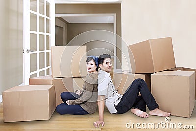 Couple resting at new home Stock Photo