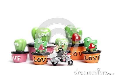 Couple riding the motorcycle in the garden , Valentine`s Day concept Stock Photo