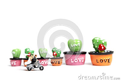 Couple riding the motorcycle in the garden , Valentine`s Day concept Stock Photo