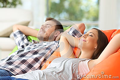 Couple or roommates relaxing at home Stock Photo