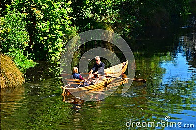 Couple Rowing row boat over Avon River Christchurch - New Zealand Editorial Stock Photo