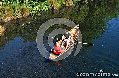 Couple Rowing row boat over Avon River Christchurch - New Zealand Editorial Stock Photo