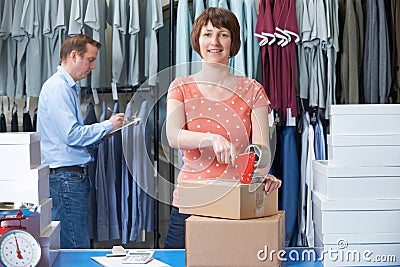 Couple Running Online Clothing Business Stock Photo