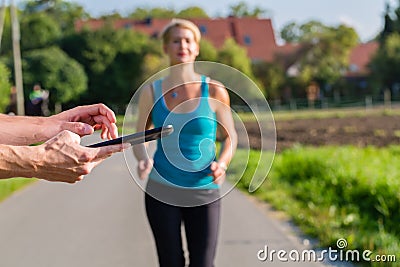 Couple running, sport jogging on rural street Stock Photo