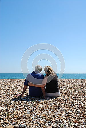 Couple sat alone together Stock Photo