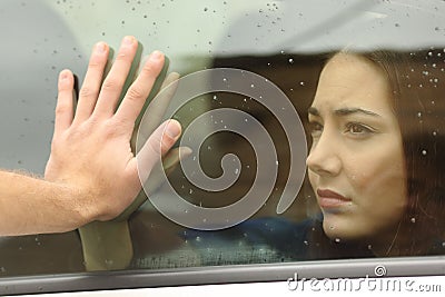 Couple saying goodbye before car travel Stock Photo
