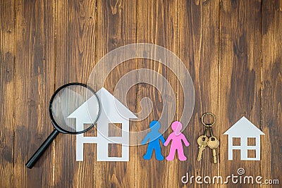 Couple searching a new big house, paper house with key Stock Photo