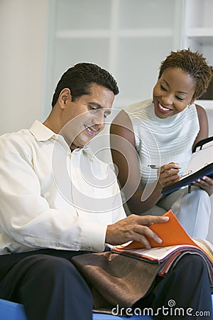 Couple Selecting Fabric From Swatch Stock Photo