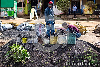 Couple selling charcoal Editorial Stock Photo