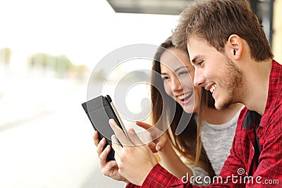 Couple sharing media content from a tablet Stock Photo