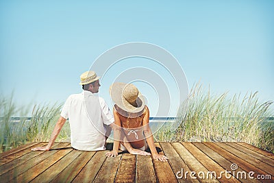 Couple Sitting Comfortable Beach Grass Holiday Concept Stock Photo