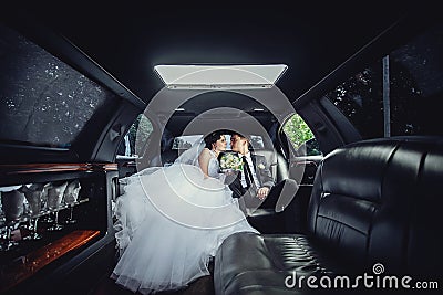 The couple sitting in the limo. Portrait of a beautiful young couple who rides around the city Stock Photo